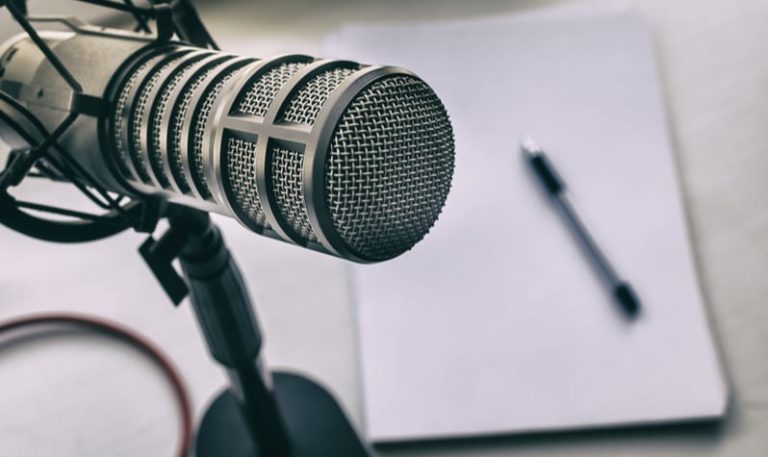 microphone-closeup-pen-and-paper-in-background