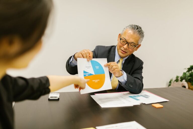 Two People Having a Meeting in the Office