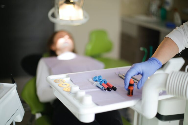 Anonymous doctor using tools during dental surgery